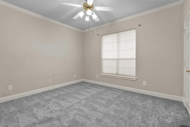 carpeted empty room featuring ceiling fan and crown molding