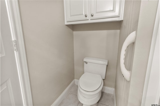 bathroom with tile patterned floors and toilet