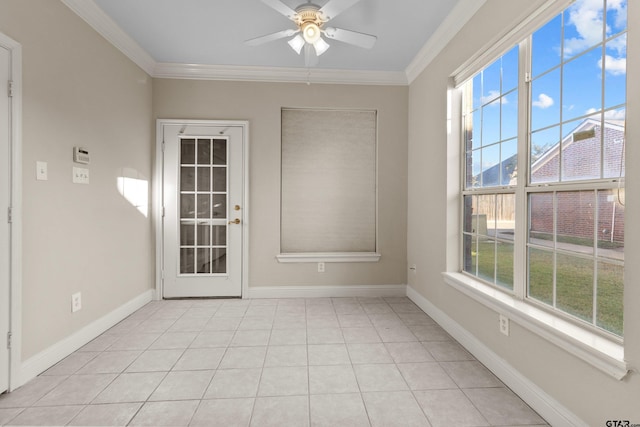 tiled empty room with ceiling fan and crown molding