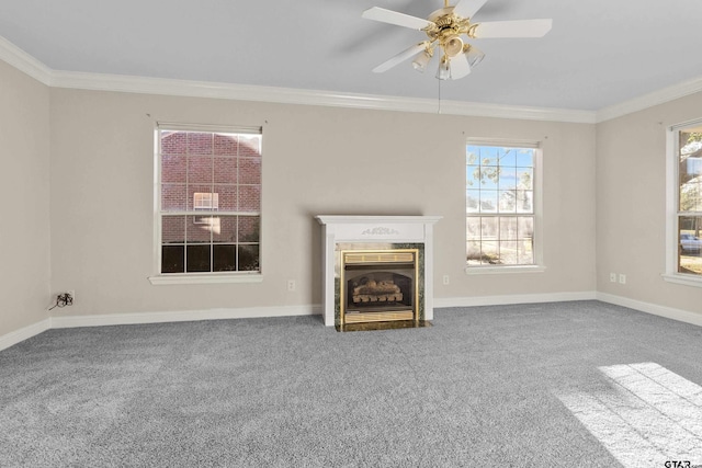 unfurnished living room with ceiling fan, crown molding, and carpet