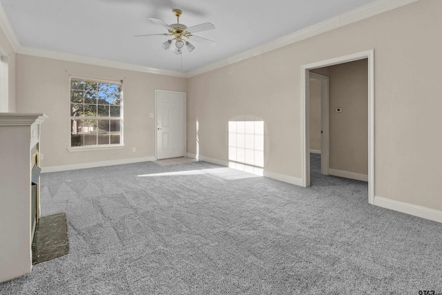 unfurnished living room with ornamental molding, light carpet, and ceiling fan