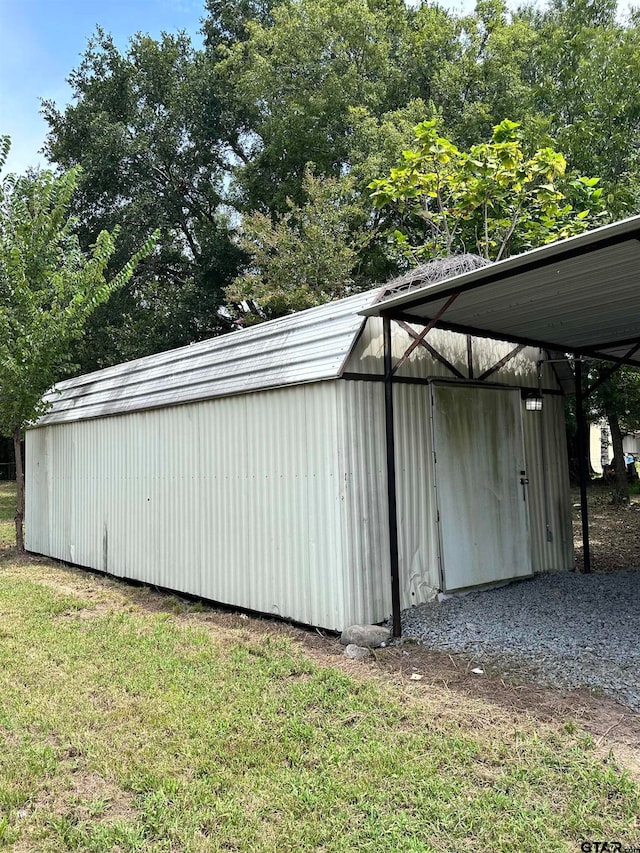 view of outbuilding with an outbuilding and a carport