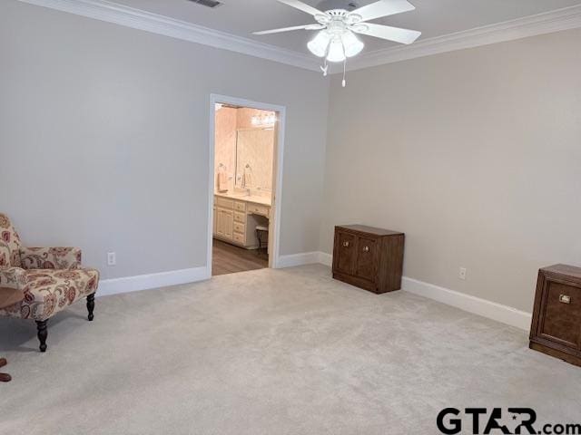 living area featuring light carpet, ceiling fan, and ornamental molding