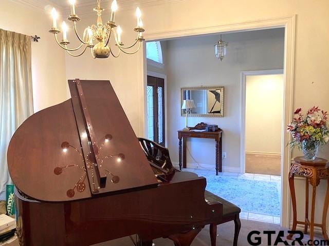 living area featuring a chandelier