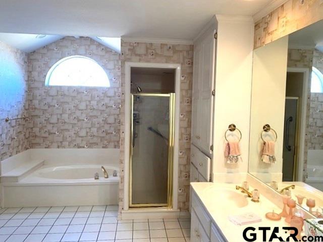 full bath with ornamental molding, a stall shower, vanity, tile patterned flooring, and a bath