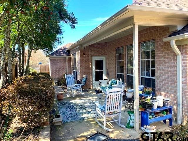 view of patio featuring fence