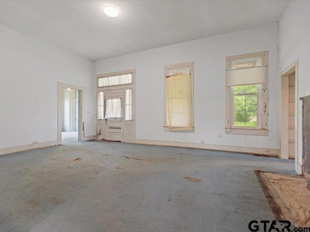 unfurnished living room with carpet floors