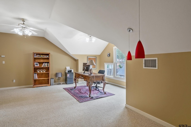 carpeted office space with lofted ceiling, a ceiling fan, visible vents, and baseboards