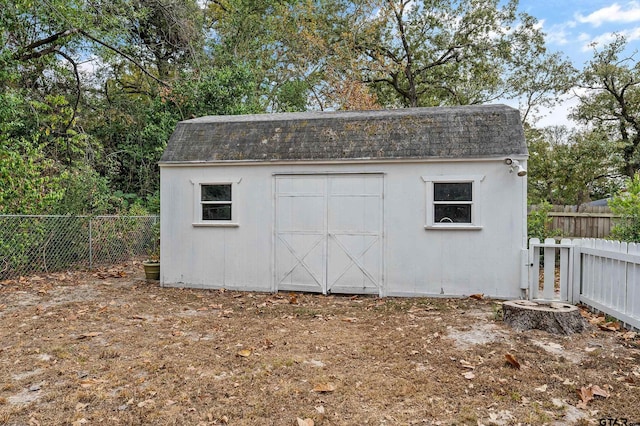 view of shed with a fenced backyard