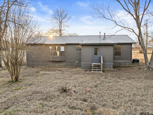 back of property featuring central air condition unit