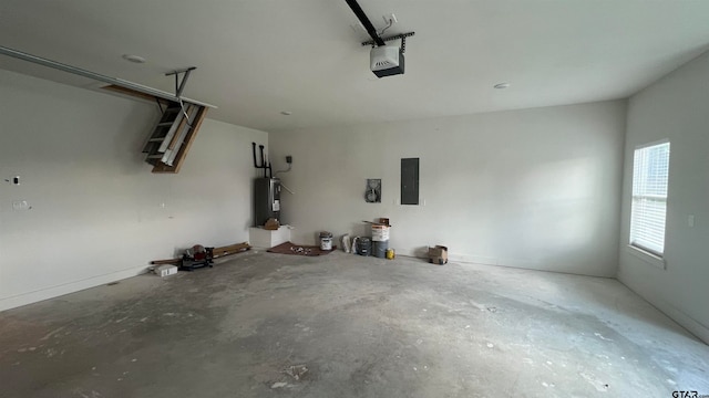 garage featuring electric panel, a garage door opener, and water heater