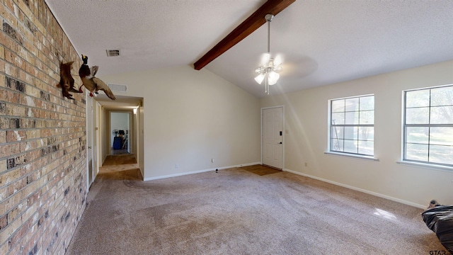 unfurnished living room featuring ceiling fan, brick wall, light carpet, and lofted ceiling with beams