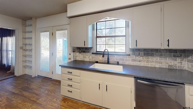 kitchen featuring dark wood-type flooring, white cabinets, sink, and dishwasher