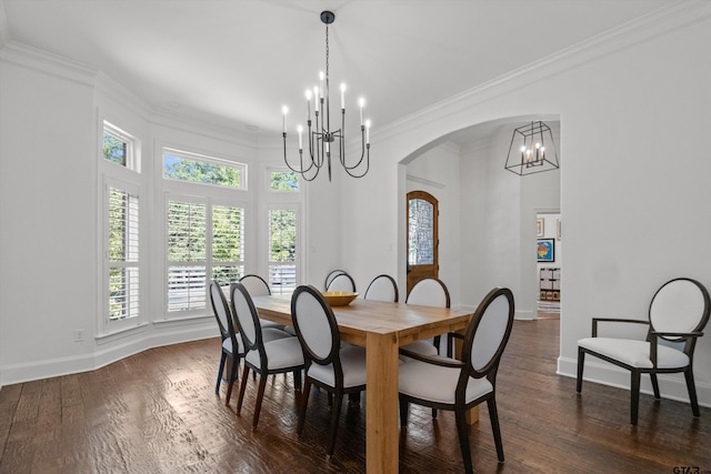 dining space featuring a notable chandelier, dark wood-style floors, arched walkways, and ornamental molding