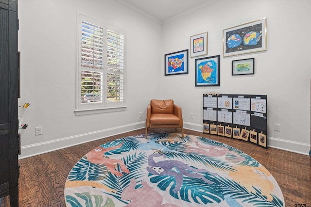 sitting room featuring crown molding, wood finished floors, and baseboards