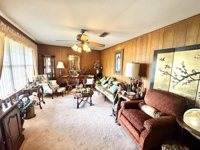 1115 Sunset Ave, Jacksonville, TX 75766 - carpeted living area with wood walls and a ceiling fan