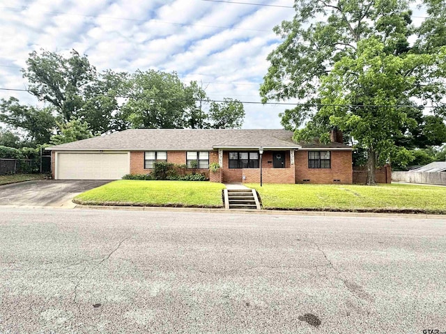 1115 Sunset Ave, Jacksonville, TX 75766 - ranch-style house with driveway, an attached garage, brick siding, a chimney, and crawl space