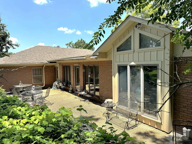 back of property featuring a patio