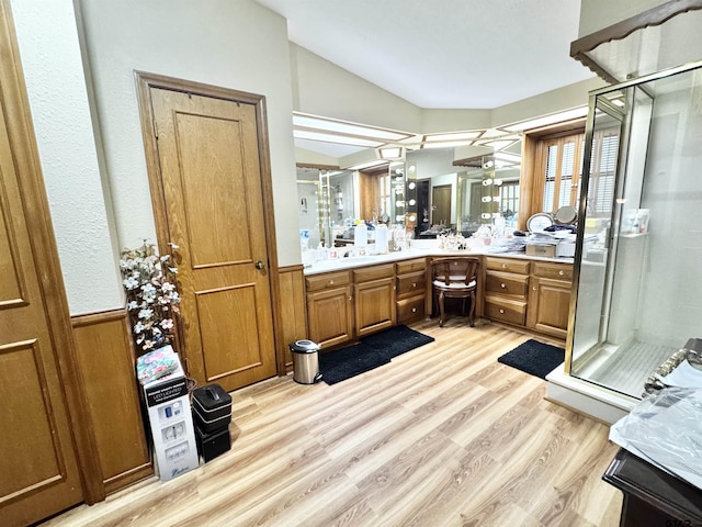 1115 Sunset Ave, Jacksonville, TX 75766 - bathroom featuring vaulted ceiling, wood finished floors, a shower stall, and vanity