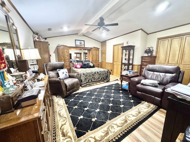 1115 Sunset Ave, Jacksonville, TX 75766 - bedroom featuring wood finished floors, a wainscoted wall, ornamental molding, and a ceiling fan