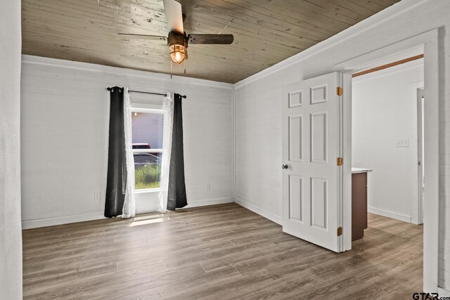 924 Kaufman St, Mount Vernon, TX 75457 - empty room featuring ceiling fan, wooden ceiling, wood finished floors, and baseboards