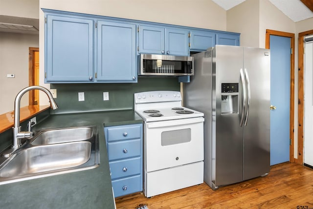 kitchen with hardwood / wood-style floors, sink, blue cabinetry, and appliances with stainless steel finishes