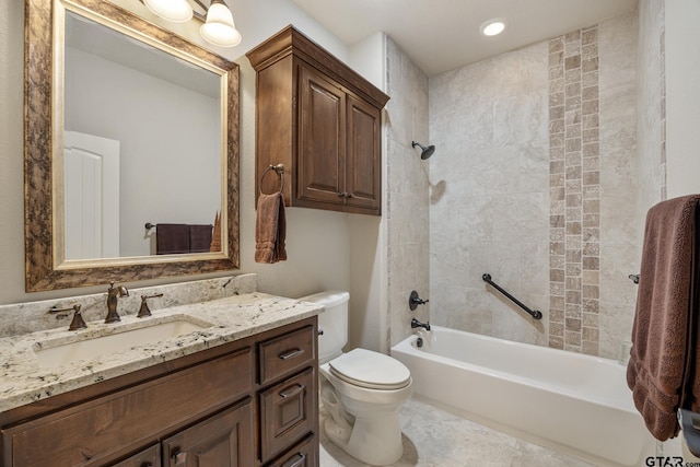 bathroom featuring vanity, shower / bathing tub combination, and toilet