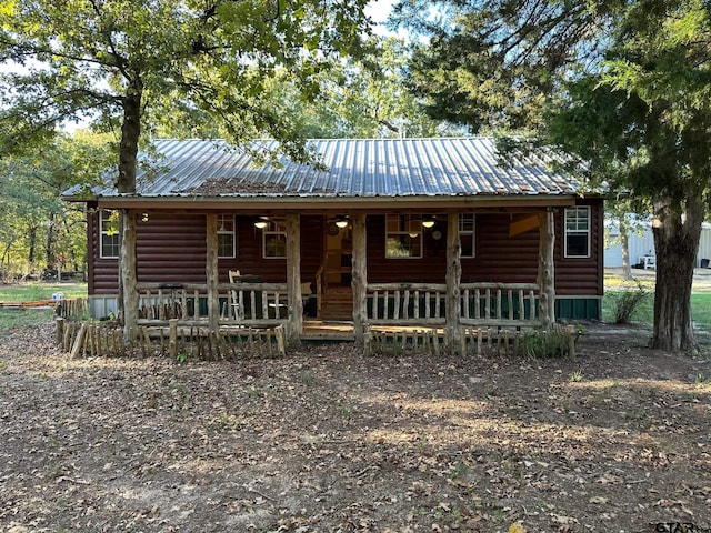 cabin featuring covered porch