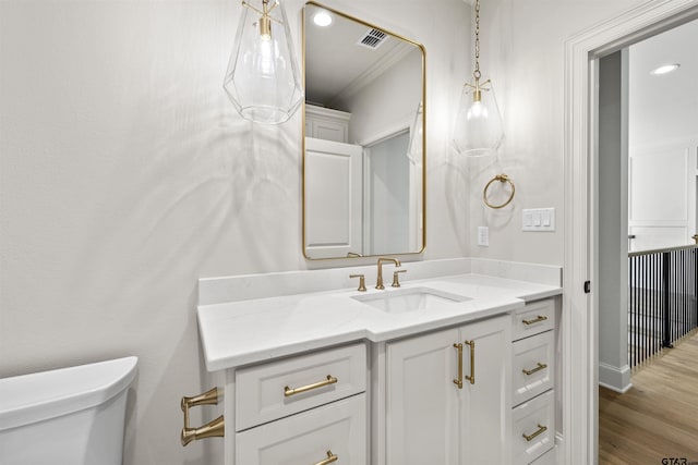 8810 Wilder Trl, Tyler, TX 75703 - bathroom featuring vanity, wood finished floors, and crown molding