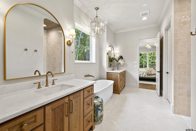 8810 Wilder Trl, Tyler, TX 75703 - bathroom with two vanities, a freestanding bath, crown molding, connected bathroom, and tile patterned flooring
