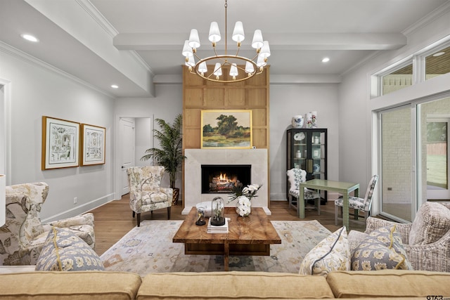 8810 Wilder Trl, Tyler, TX 75703 - living area with wood finished floors, crown molding, a chandelier, a large fireplace, and recessed lighting