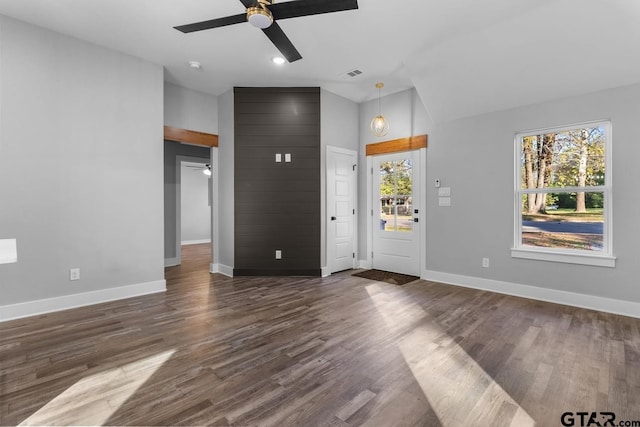 foyer featuring ceiling fan and dark wood-type flooring