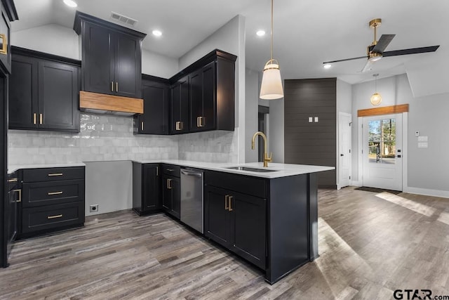 kitchen with pendant lighting, ceiling fan, sink, and hardwood / wood-style floors