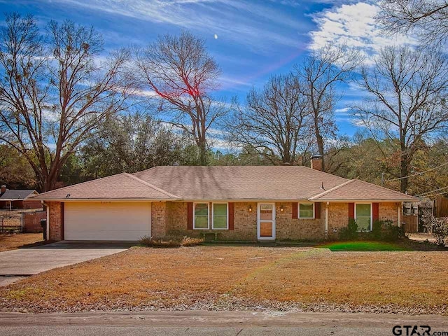 single story home featuring a garage