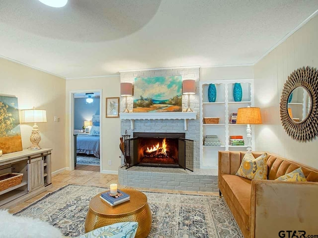 living room with a brick fireplace, a textured ceiling, and light tile patterned floors