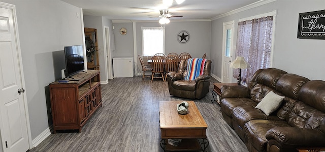7506 Romans Rd, Athens, TX 75751 - living area featuring dark wood-style floors, ceiling fan, baseboards, and ornamental molding