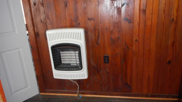 details with heating unit and wood walls
