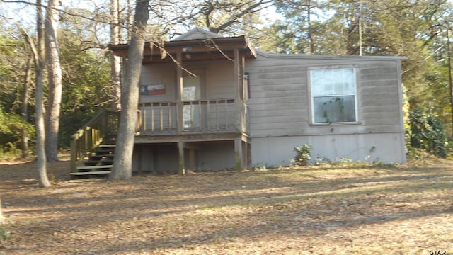 view of front facade featuring stairway