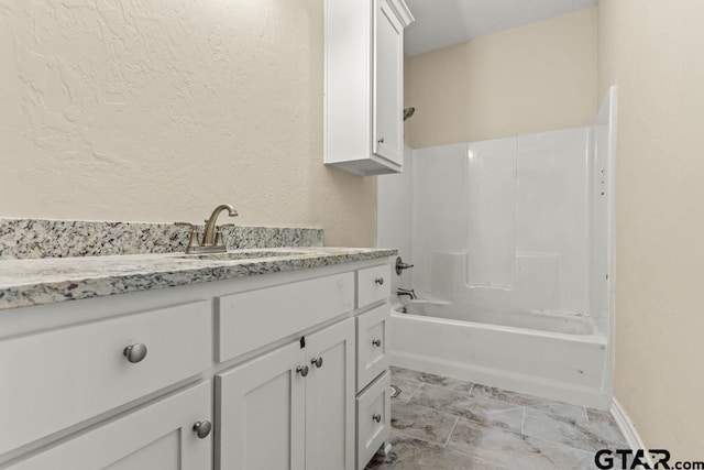 bathroom with vanity and tub / shower combination