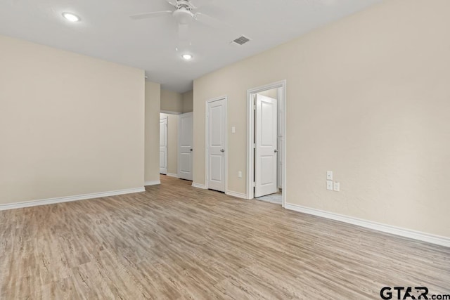 unfurnished room with light hardwood / wood-style floors and ceiling fan