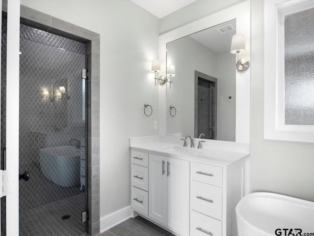 bathroom with tile patterned flooring, vanity, and an enclosed shower