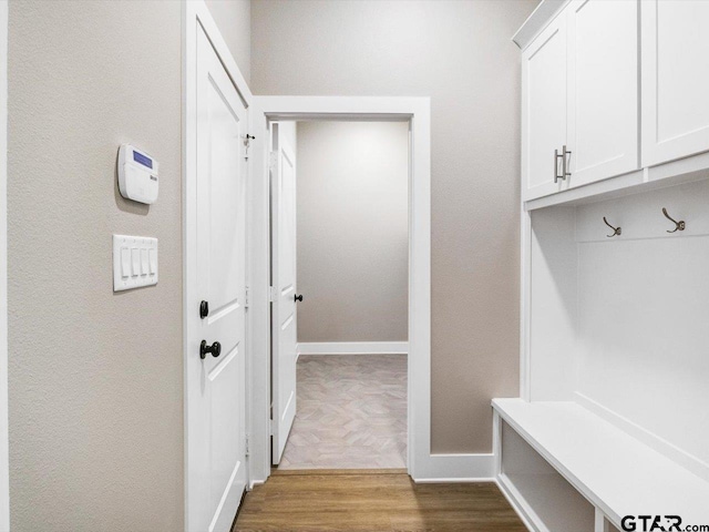 mudroom with light parquet flooring