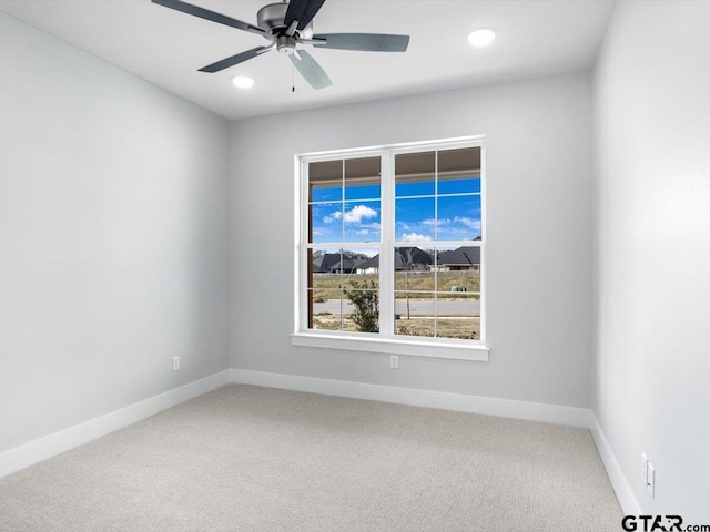 carpeted empty room with ceiling fan