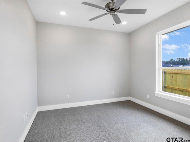 empty room featuring carpet flooring and ceiling fan