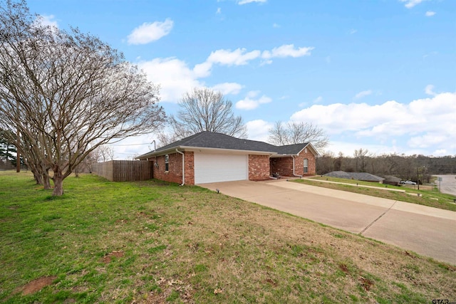 view of side of property with a garage and a lawn