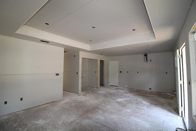 empty room featuring a tray ceiling