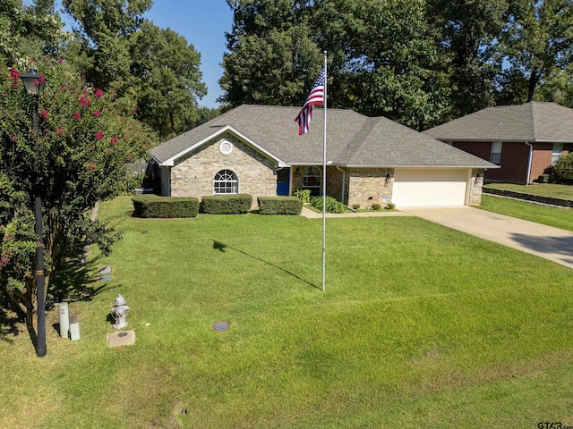 single story home with a garage, stone siding, driveway, and a front yard