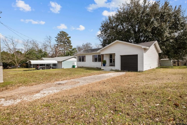 single story home with a garage, a front yard, and driveway