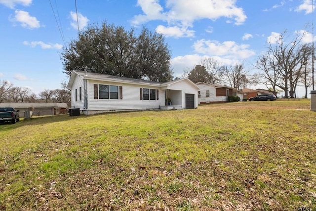 view of front facade with a front lawn, crawl space, and an attached garage