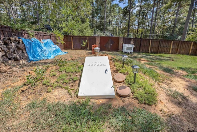 18058 Whispering Pines Rd, Flint, TX 75762 - view of storm shelter with a fenced backyard and view of scattered trees